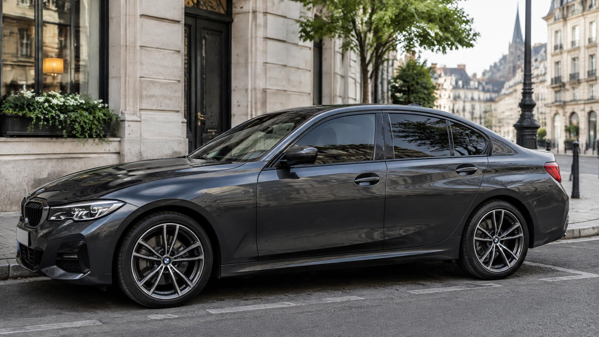Dark sedan with tinted windows parked on a city street